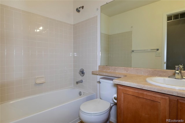 full bathroom with washtub / shower combination, vanity, and toilet