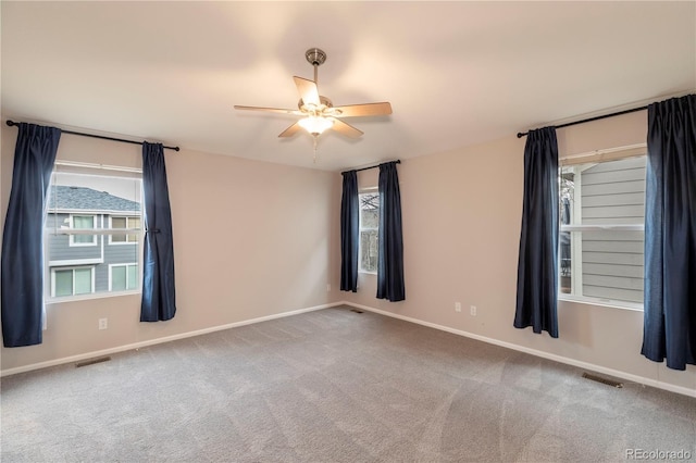 empty room featuring carpet and ceiling fan