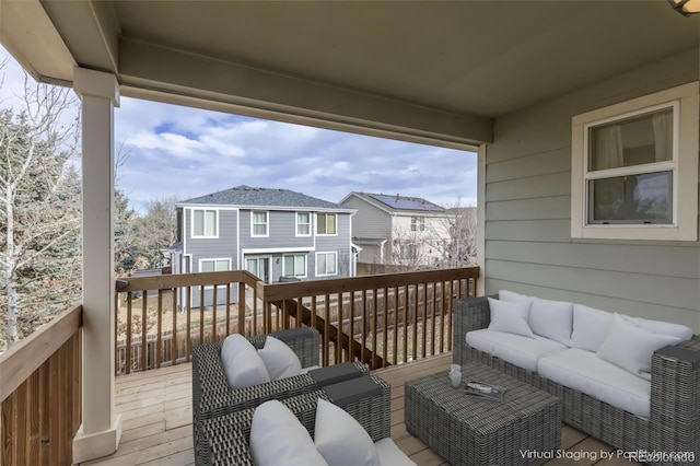 wooden terrace with an outdoor hangout area