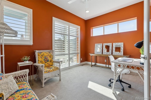 carpeted office with plenty of natural light, baseboards, and a ceiling fan