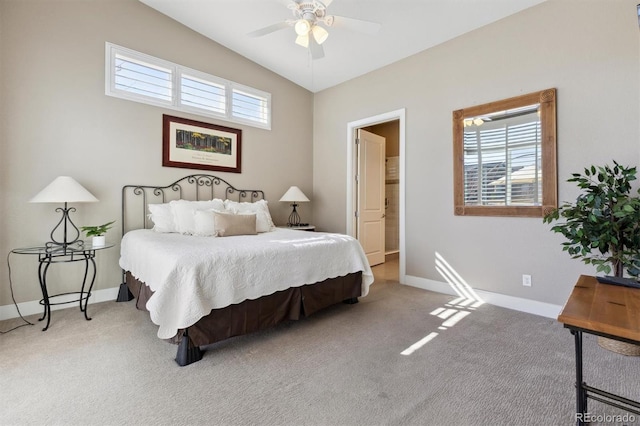 carpeted bedroom featuring lofted ceiling, multiple windows, a ceiling fan, and baseboards