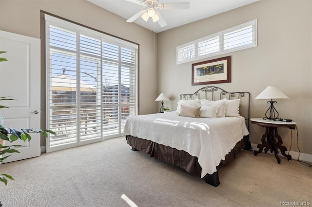 bedroom with ceiling fan, access to outside, carpet, and baseboards