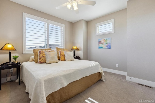 bedroom featuring a ceiling fan, carpet, visible vents, and baseboards