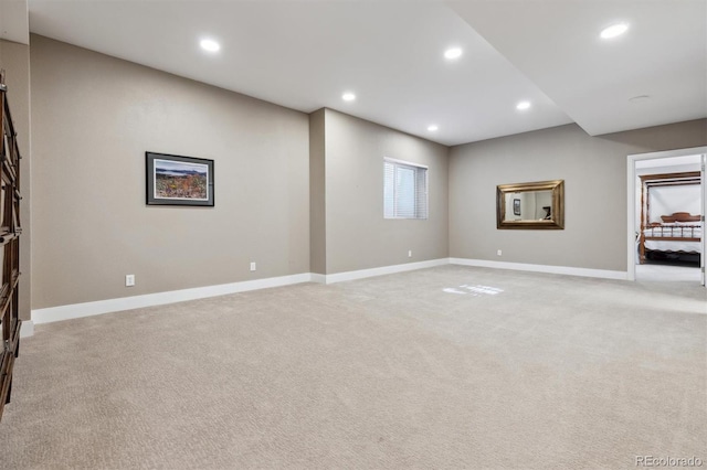 interior space featuring baseboards, light colored carpet, and recessed lighting