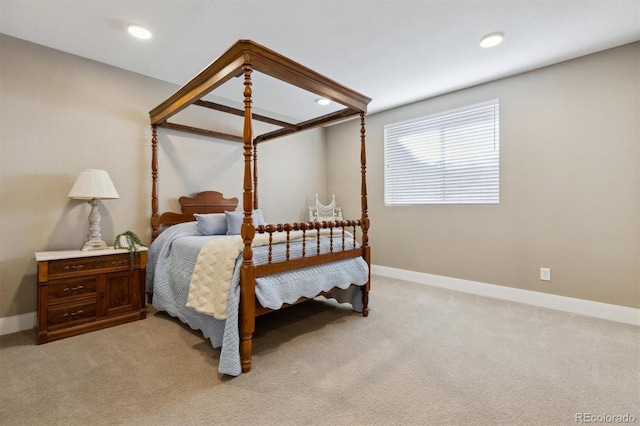 bedroom featuring light carpet, baseboards, and recessed lighting