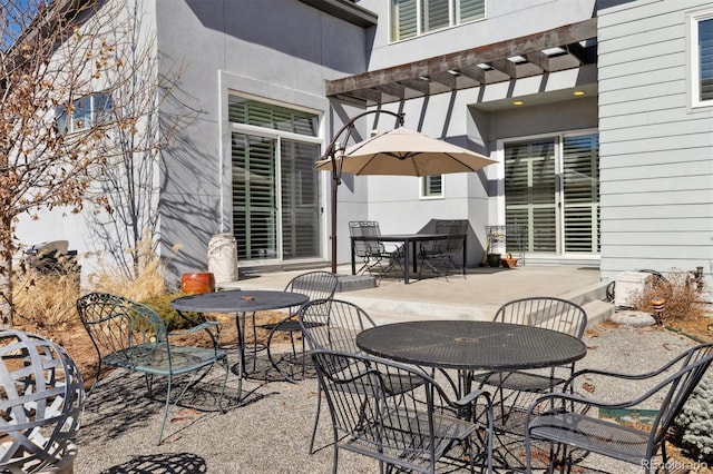 view of patio / terrace featuring a pergola and outdoor dining space