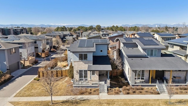 drone / aerial view featuring a mountain view and a residential view