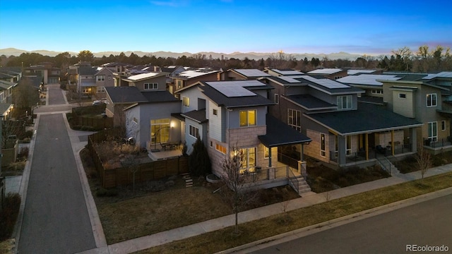 view of front of property featuring stone siding and a residential view