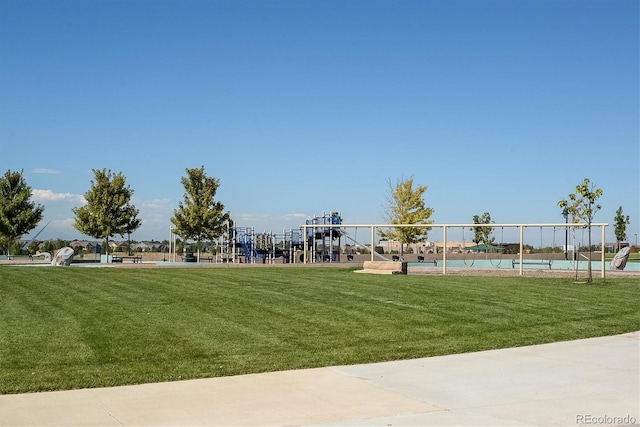 surrounding community featuring a lawn and a swimming pool