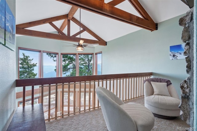 interior space with vaulted ceiling with beams and ceiling fan