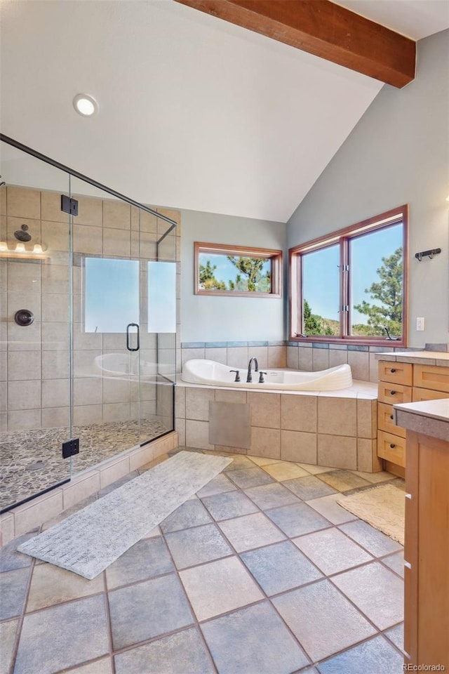 bathroom with vanity, lofted ceiling with beams, and plus walk in shower