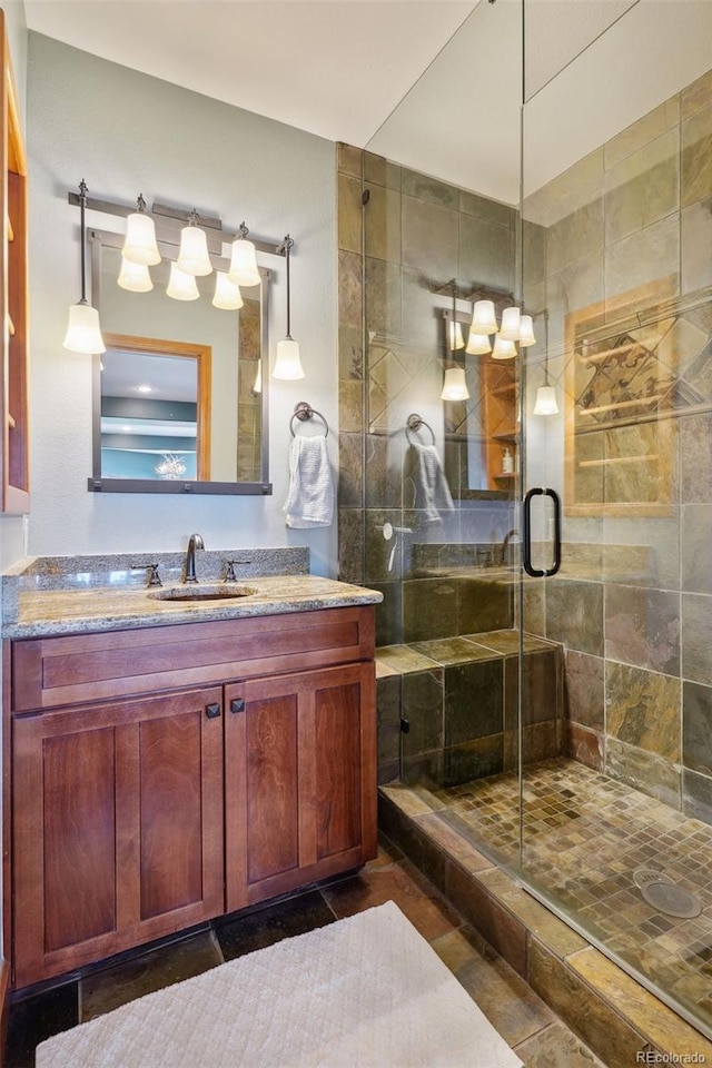 bathroom with vanity and an enclosed shower