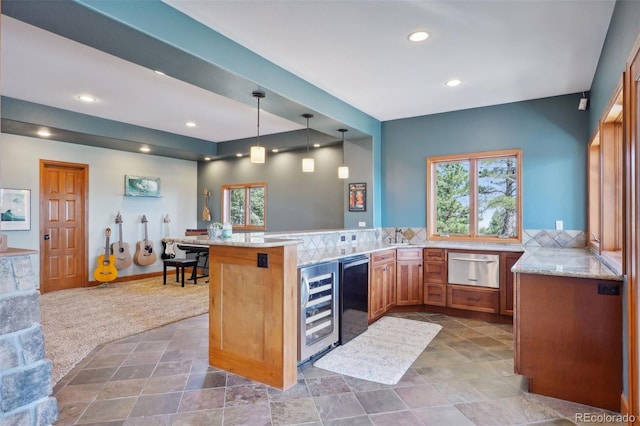 12421 High Country Trl, Littleton, CO 80127 - kitchen with wine cooler, a peninsula, brown cabinets, light stone counters, and a warming drawer