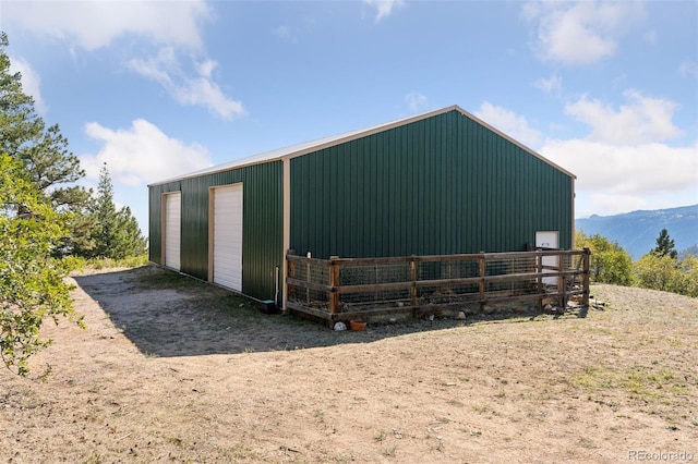 view of outbuilding with a mountain view