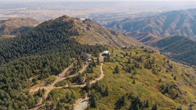 12421 High Country Trl, Littleton, CO 80127 - view of mountain backdrop with a heavily wooded area