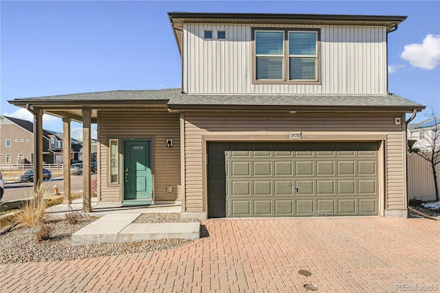 view of front of property with a garage