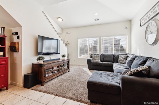 living room featuring light tile patterned flooring and plenty of natural light