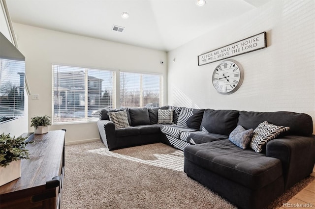 living room featuring light carpet