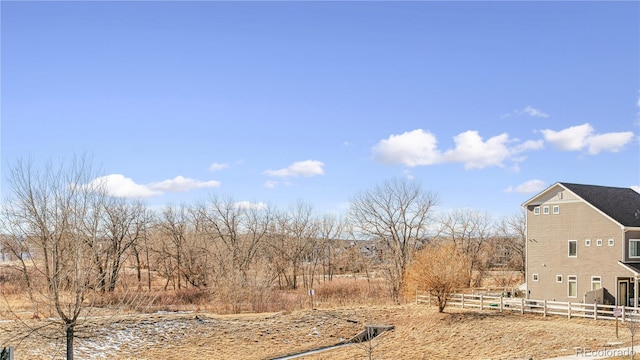 view of yard with a rural view