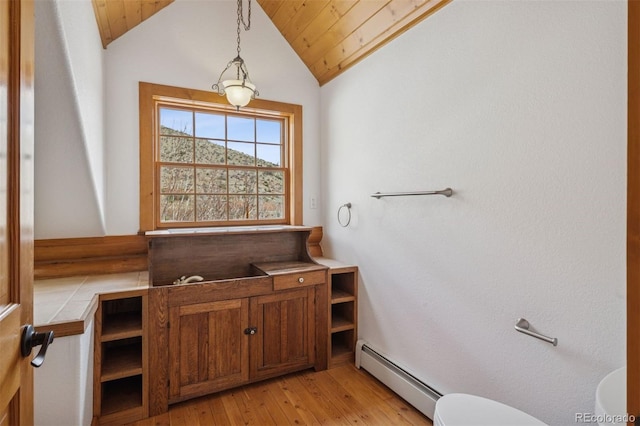 bathroom featuring wooden ceiling, hardwood / wood-style floors, lofted ceiling, and a baseboard radiator