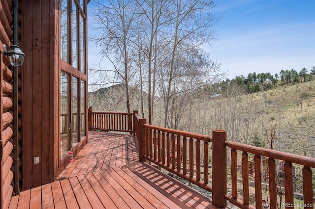 wooden deck with a mountain view