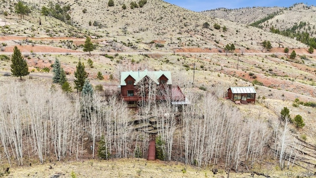 birds eye view of property with a mountain view