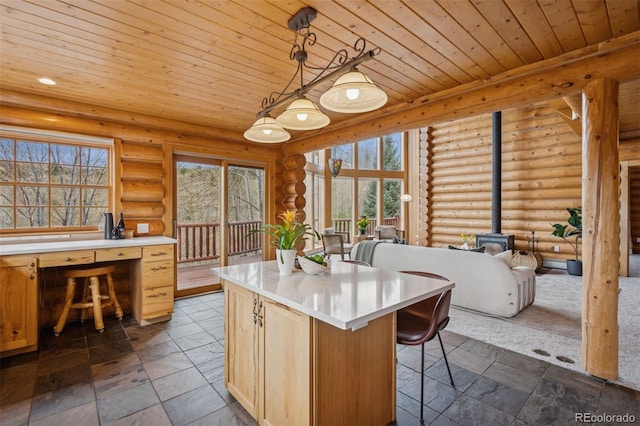 kitchen featuring light countertops, wood ceiling, log walls, and a wood stove