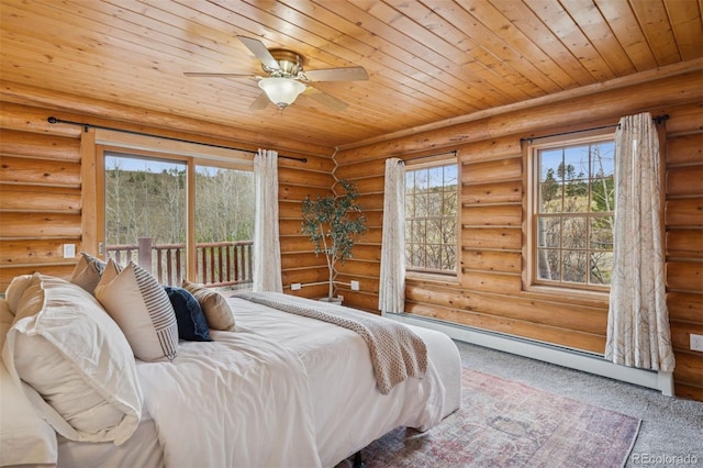 bedroom with a baseboard radiator, wood ceiling, carpet flooring, and multiple windows