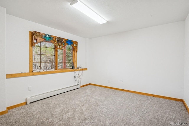 empty room featuring baseboards, a textured ceiling, carpet, and baseboard heating