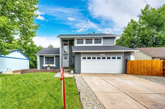 7840 W Portland Ave, Littleton, CO 80128 - view of front of property featuring driveway, a garage, brick siding, and roof with shingles