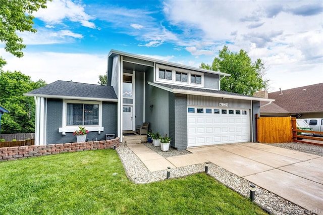 7840 W Portland Ave, Littleton, CO 80128 - view of front of house with concrete driveway, a garage, and brick siding