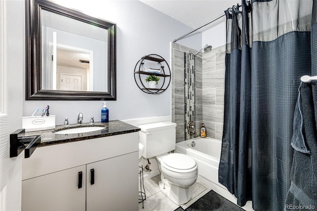 7840 W Portland Ave, Littleton, CO 80128 - full bath featuring shower / bath combo with shower curtain, vanity, and tile patterned floors