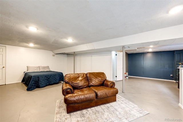 7840 W Portland Ave, Littleton, CO 80128 - living room featuring finished concrete floors and a textured ceiling