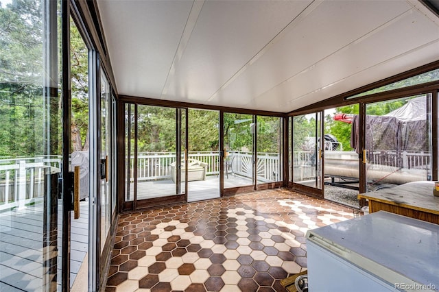 7840 W Portland Ave, Littleton, CO 80128 - unfurnished sunroom featuring vaulted ceiling