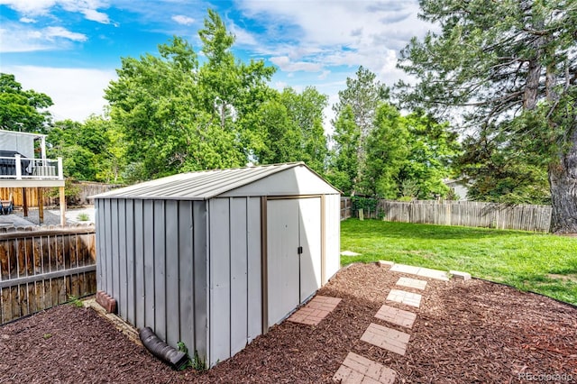 7840 W Portland Ave, Littleton, CO 80128 - view of shed with a fenced backyard and view of scattered trees