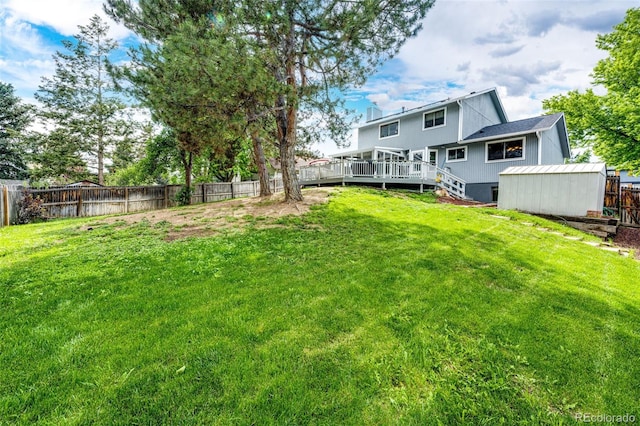 7840 W Portland Ave, Littleton, CO 80128 - view of yard featuring a deck and an outdoor structure