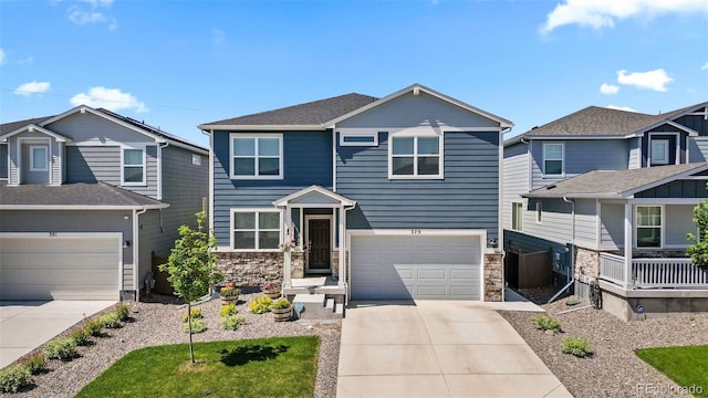 379 Silver Rock Trl, Castle Rock, CO 80104 - view of front of house with concrete driveway, a garage, and stone siding