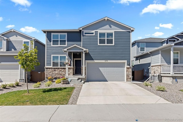 379 Silver Rock Trl, Castle Rock, CO 80104 - view of front of property featuring stone siding, driveway, and an attached garage
