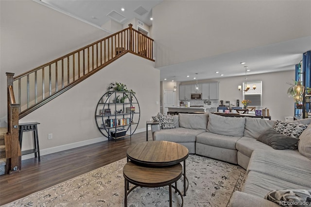 379 Silver Rock Trl, Castle Rock, CO 80104 - living area with dark wood-style floors, stairway, a chandelier, and recessed lighting