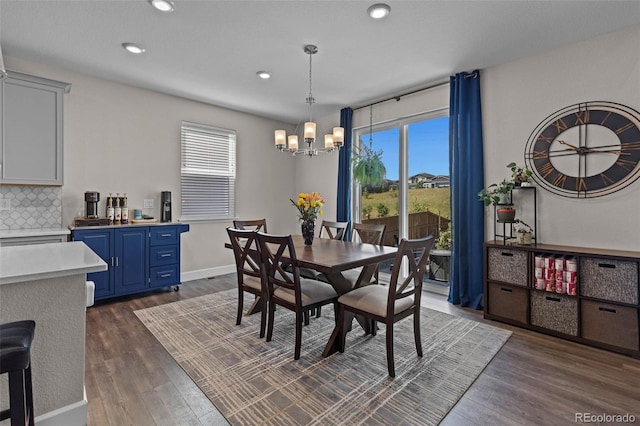 379 Silver Rock Trl, Castle Rock, CO 80104 - dining room featuring healthy amount of natural light, a chandelier, dark wood-style flooring, and recessed lighting