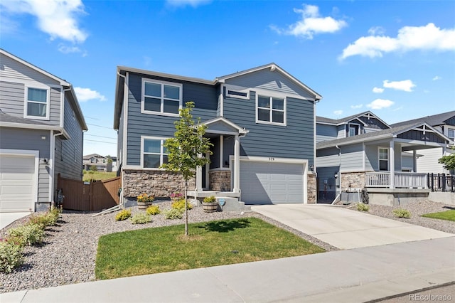 379 Silver Rock Trl, Castle Rock, CO 80104 - view of front facade with stone siding, a garage, and concrete driveway