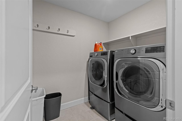 379 Silver Rock Trl, Castle Rock, CO 80104 - laundry room featuring washer and dryer and light tile patterned floors