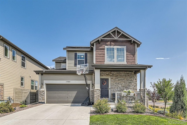 craftsman inspired home with a porch and a garage