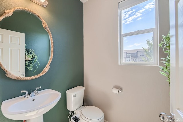 bathroom featuring toilet and sink