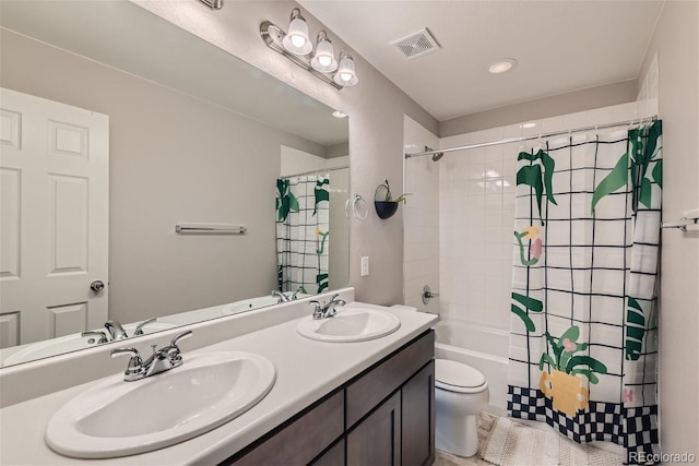 full bathroom with vanity, shower / bath combination with curtain, and toilet