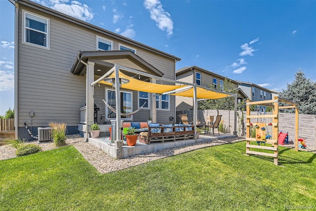 rear view of house featuring central air condition unit, a patio area, a yard, and an outdoor hangout area