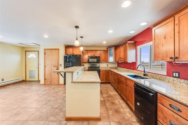 kitchen with a breakfast bar area, light stone counters, a center island, black appliances, and a sink