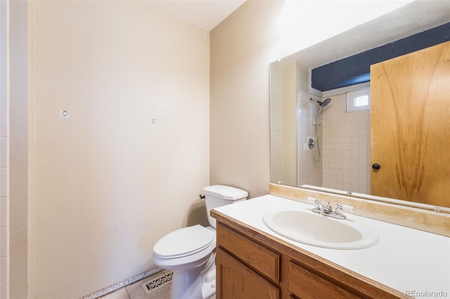 bathroom with a shower, vanity, and toilet