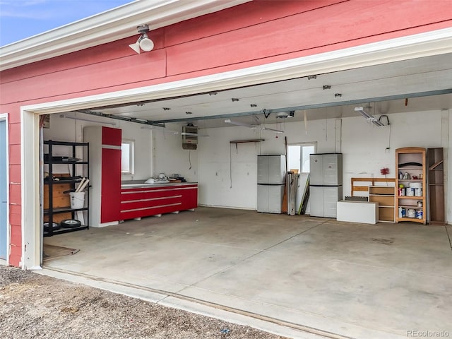 garage featuring freestanding refrigerator