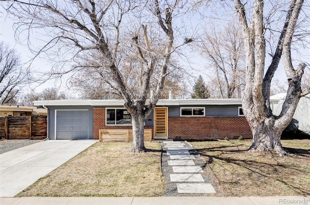 ranch-style home with brick siding, driveway, a garage, and fence